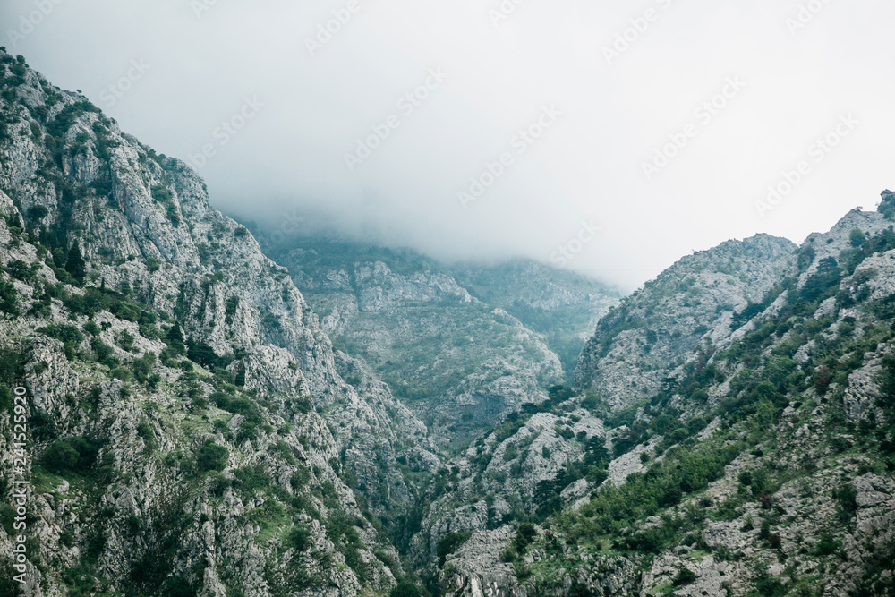 Beautiful view of the mountains in the fog in Montenegro. Natural landscape.