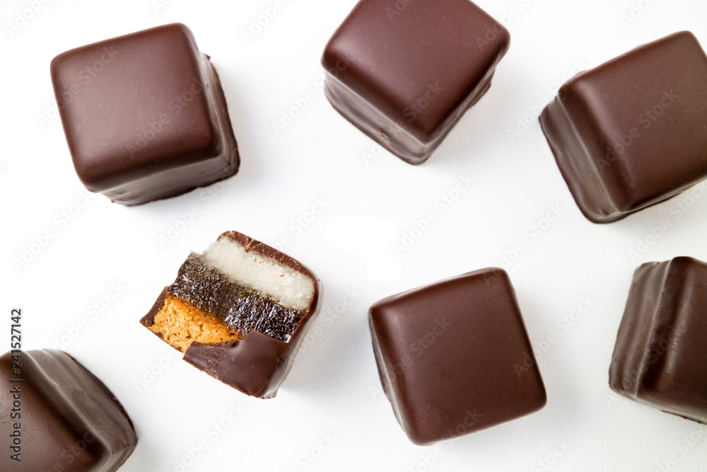 Pattern of chocolate candies. Chocolate pralines, truffles, marmalade, marzipan bonbons top view Pattern of chocolate candies. Chocolate pralines, truffles, marmalade, marzipan bonbons top view
