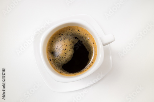 Coffee espresso. Cup of coffee on white background close up. Morning, breakfast, energy concept. Top view