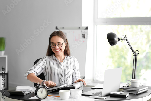 Happy businesswoman finishi...