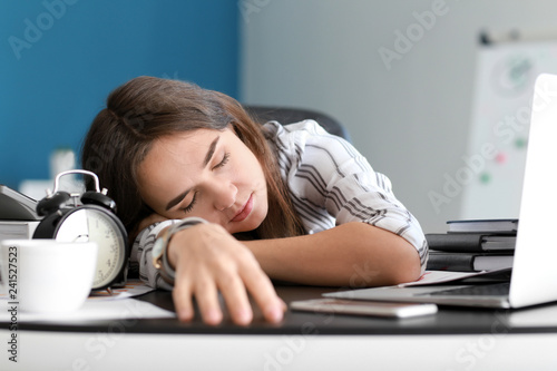 Tired businesswoman sleepin...