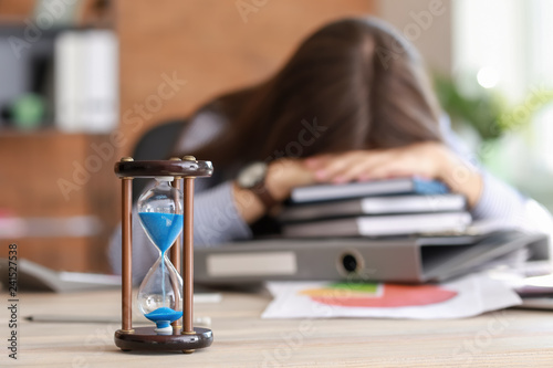 Hourglass on table of stres...