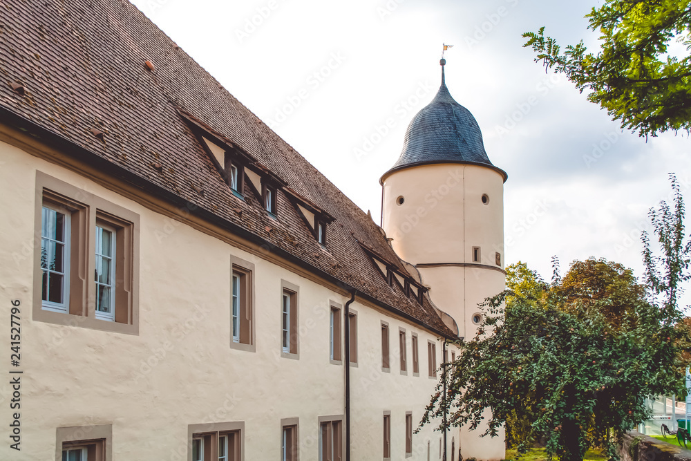 Old fortress and church in one village near the wood in Germany