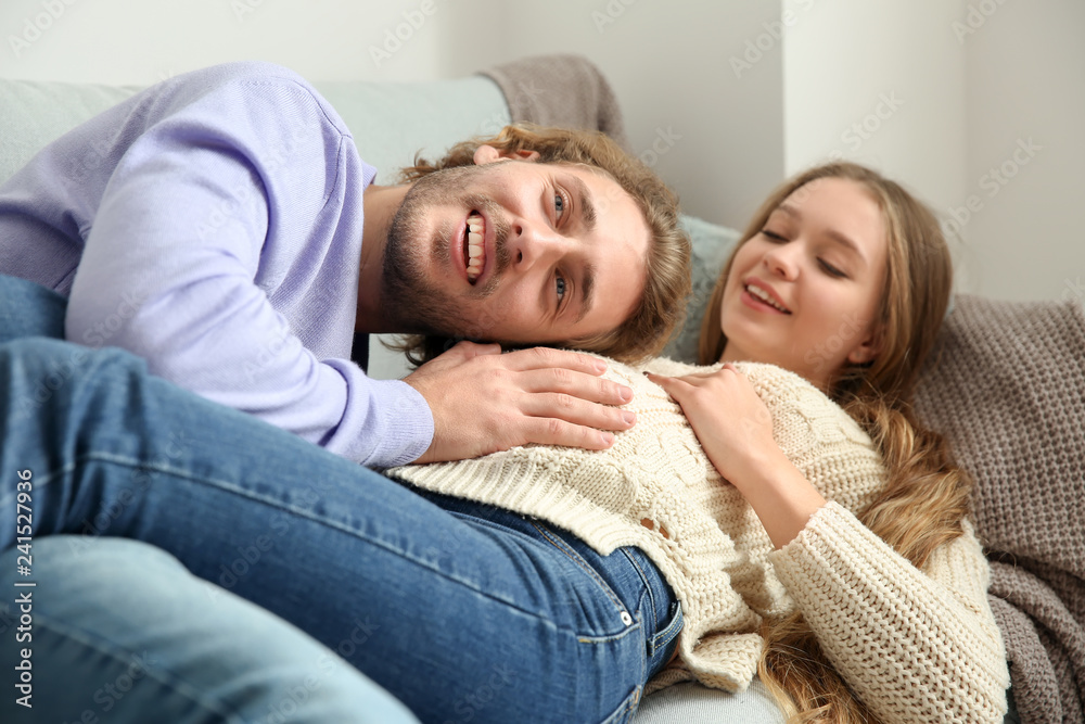 Young pregnant woman with her husband at home Young pregnant woman with her husband at home