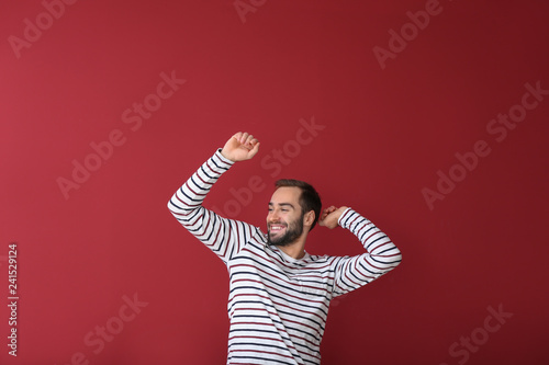 Handsome young man dancing ...