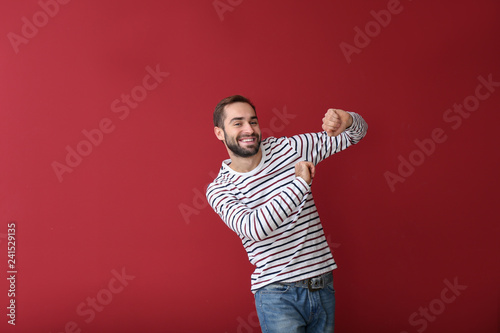 Handsome young man dancing ...