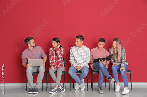 Young students sitting near...