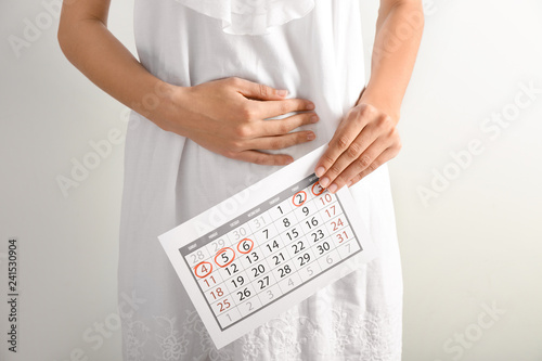 Woman with menstrual calend...