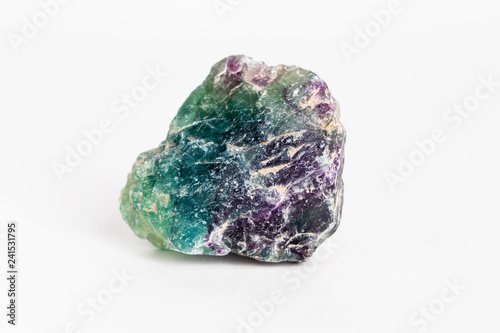 Macro of mineral stone fluorite crystal in a close-up on white background