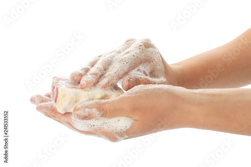 Female hands with soap on white background