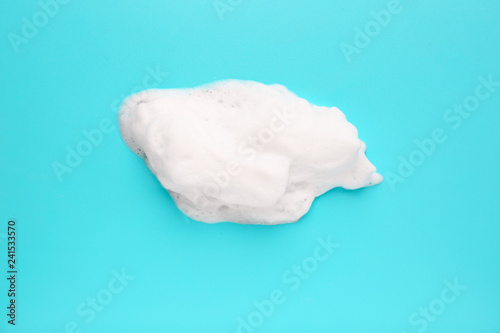 Soap foam on color background