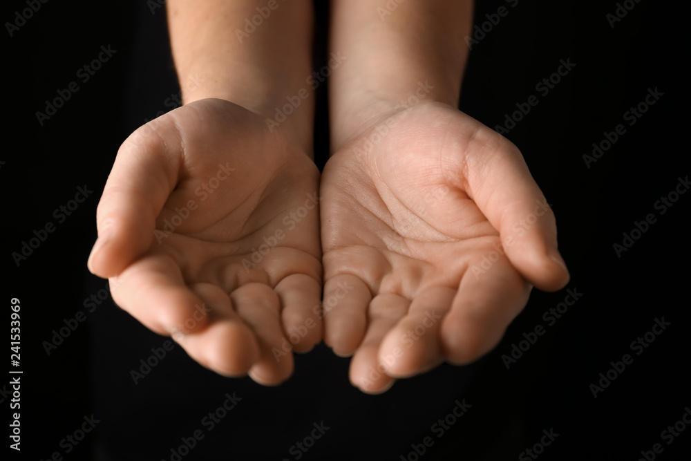 Female hands on dark background Female hands on dark background