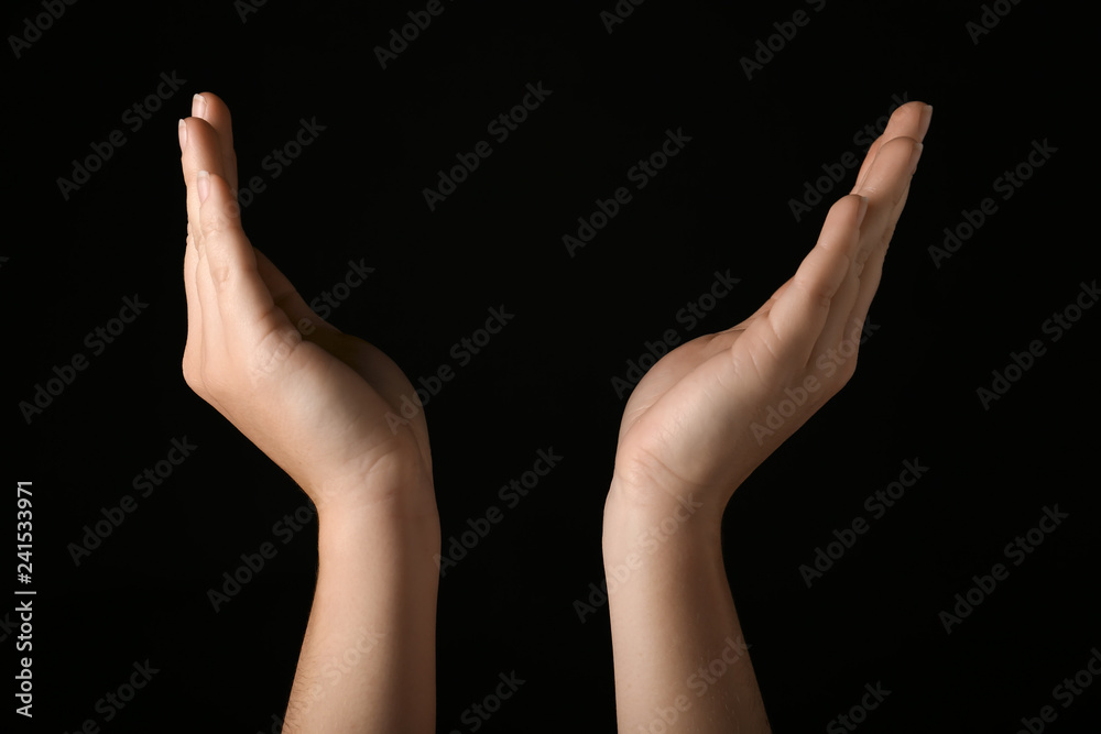 Female hands on dark background Female hands on dark background