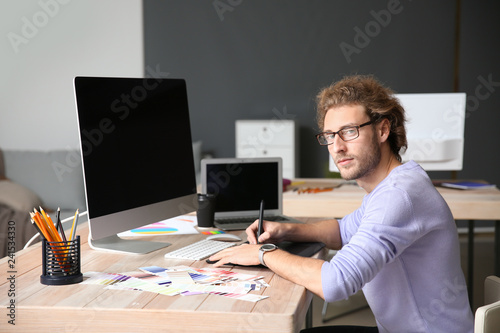 Young designer working in studio