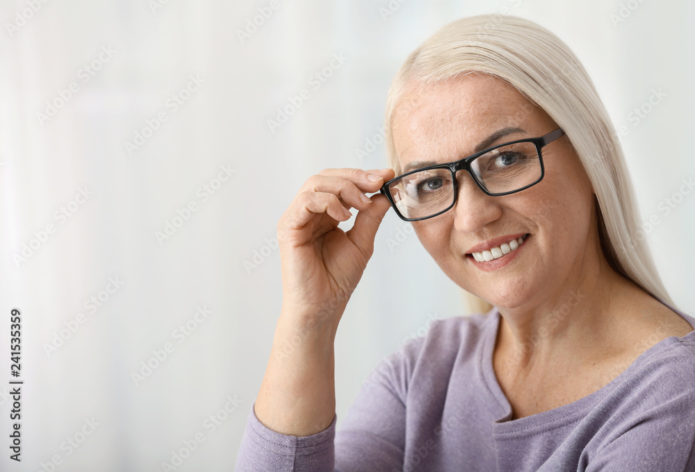 Portrait of beautiful mature woman at home