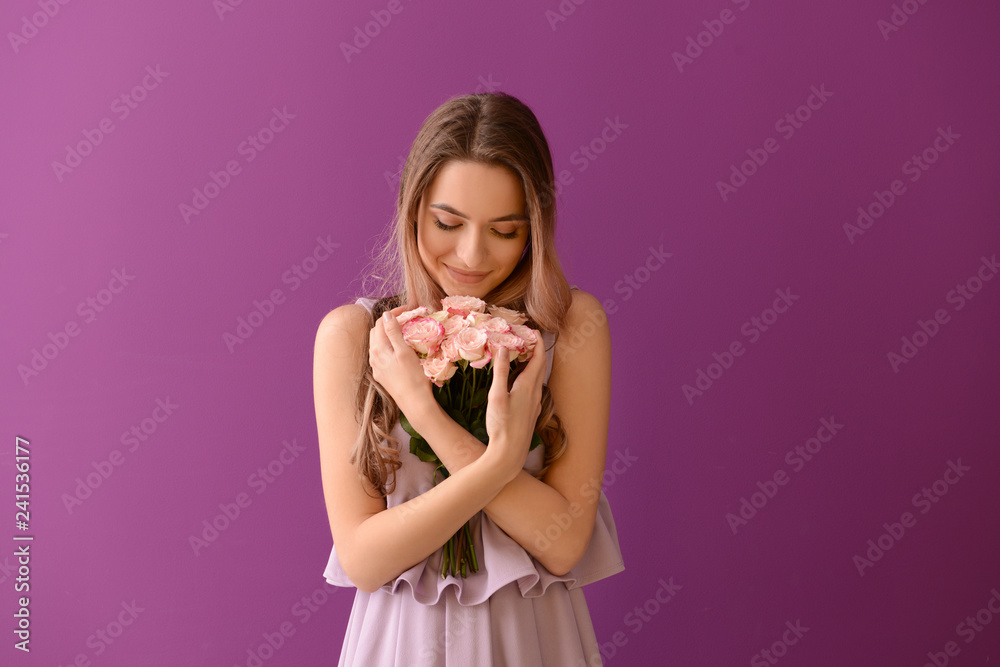 Beautiful young woman with bouquet of flowers on color background Beautiful young woman with bouquet of flowers on color background