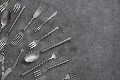 Set of cutlery on grey background