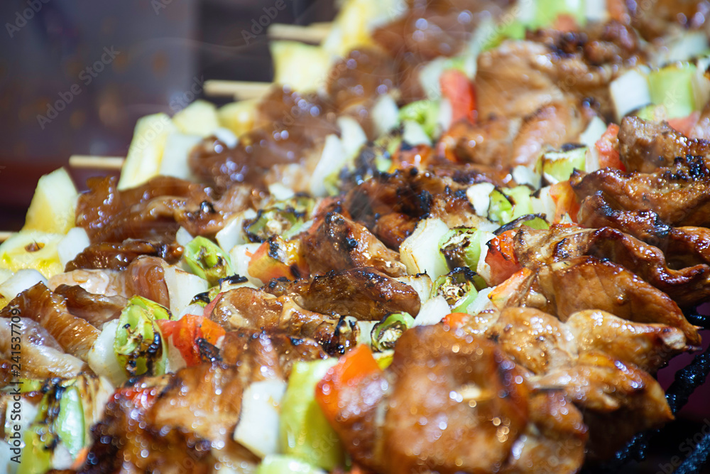 BBQ grilled meat with vegetables and tomato sauces on the steel grilles With the heat. BBQ grilled meat with vegetables and tomato sauces on the steel grilles With the heat.