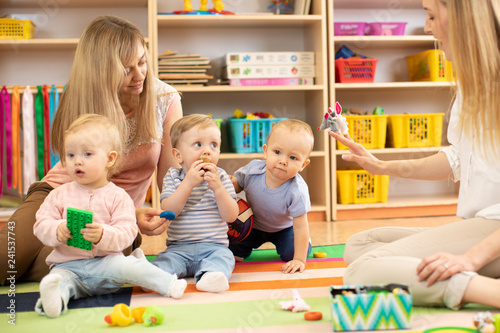 Babies is playing in nursery. Children in the daycare center. Fun in the children's playroom