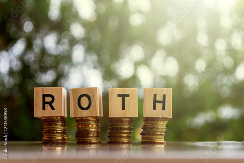 Wooden blocks with text ROTH. Business and finance concept. photo