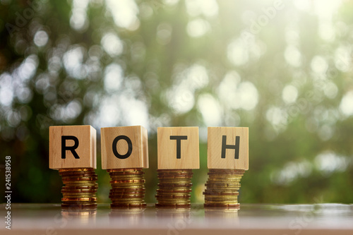 Wooden blocks with text ROTH. Business and finance concept.