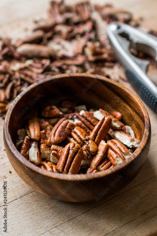 Peeled Pecan Nuts in Wooden Bowl without Shell / Walnuts. Peeled Pecan Nuts in Wooden Bowl without Shell / Walnuts.