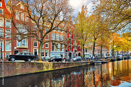 Amsterdam, Netherlands. Street with cars and traditional dutch