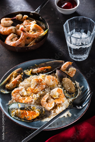 Risotto with seafood. Rice with shrimps and mussels.