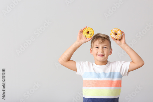 Cute little boy with donuts...