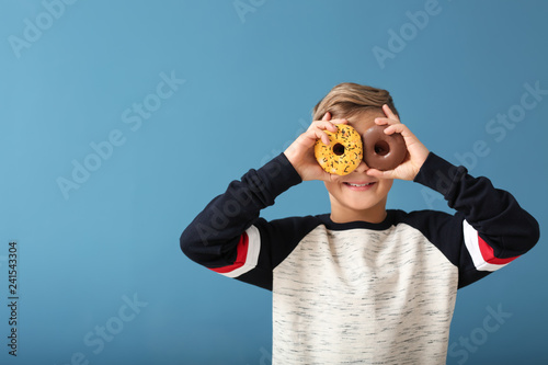 Cute little boy with donuts...