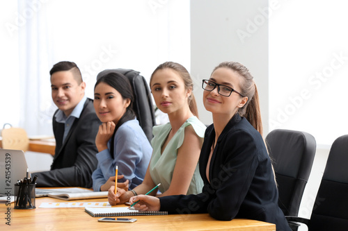 Young people having business meeting in office