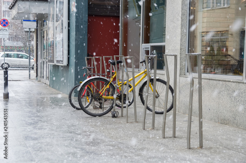 Warsaw bicycle parking at snowy winter day