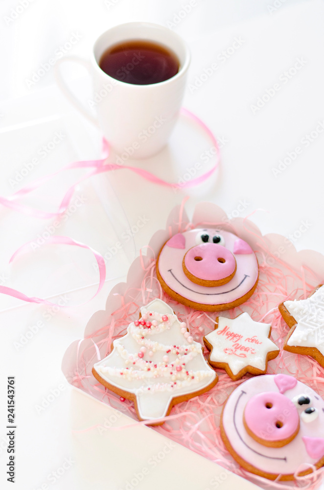 Christmas gingerbread cookies with a hot cup of tea. Christmas gingerbread cookies with a hot cup of tea.