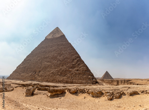 Panorama of the area with the great pyramids of Giza with Pyramid of Khafre  or Chephren  and the Pyramid of Menkaure in the far view  Egypt