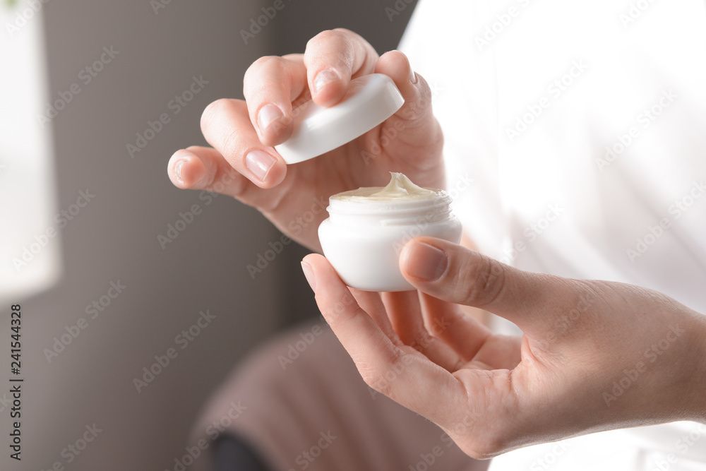 Woman with jar of cream, closeup Woman with jar of cream, closeup