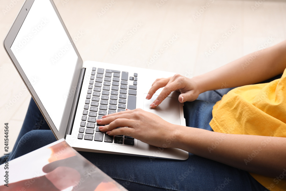 Woman using laptop at home Woman using laptop at home