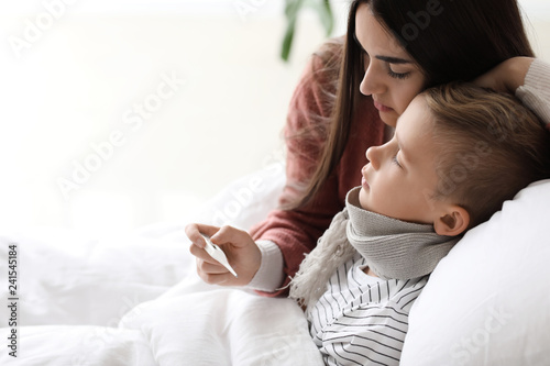 Mother taking care of his s...