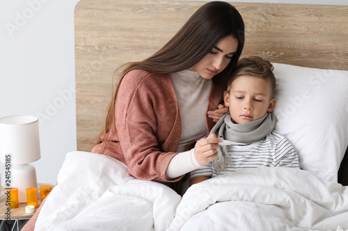 Mother taking care of his s...