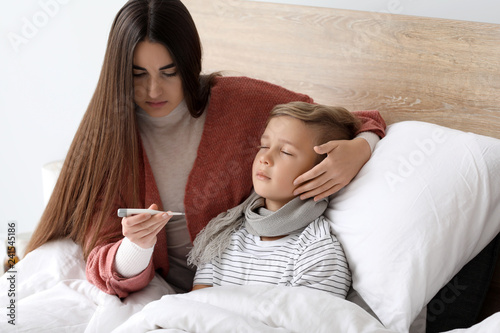 Mother taking care of his s...