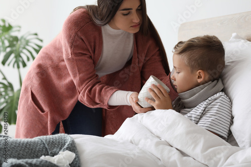 Mother taking care of his s...