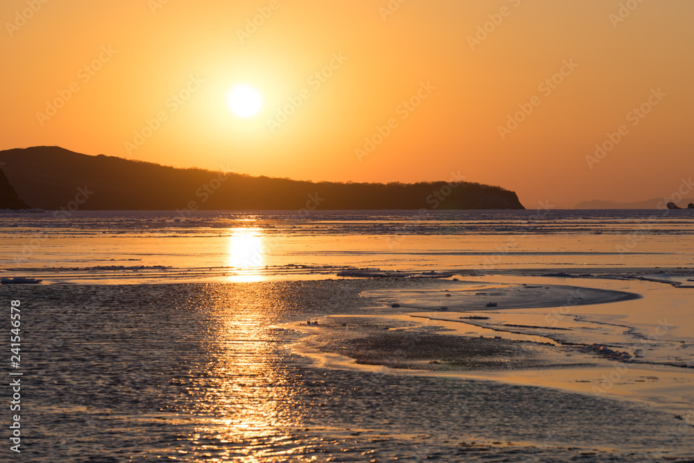 Winter seascape with ice floes on the water surface. Winter seascape with ice floes on the water surface.