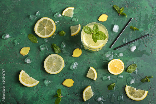 Composition with fresh lemonade on color background