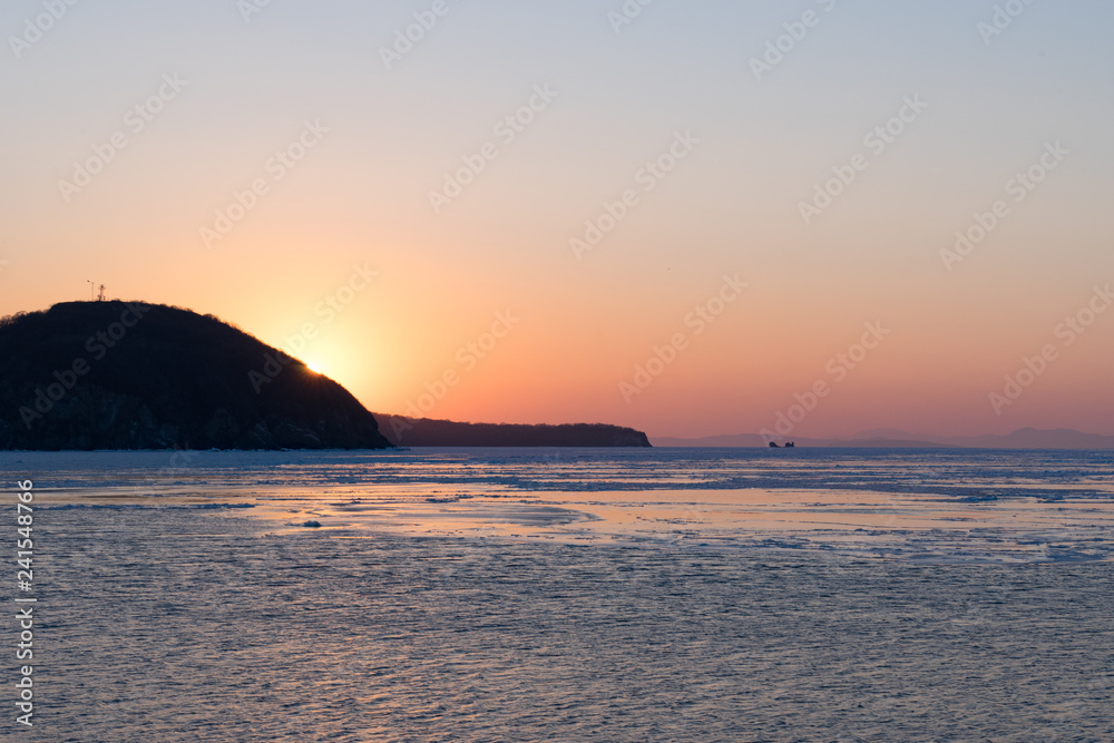 Winter seascape with ice floes on the water surface. Winter seascape with ice floes on the water surface.