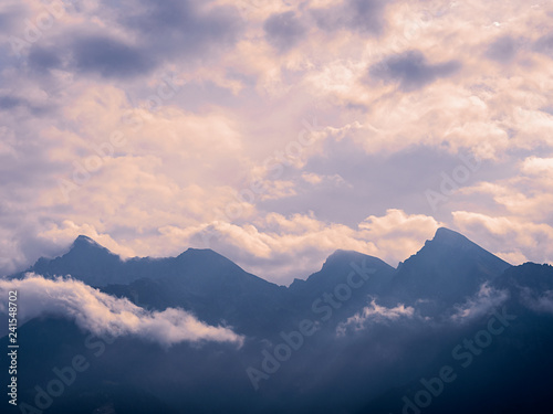 Mountain chain surrounded by clouds
