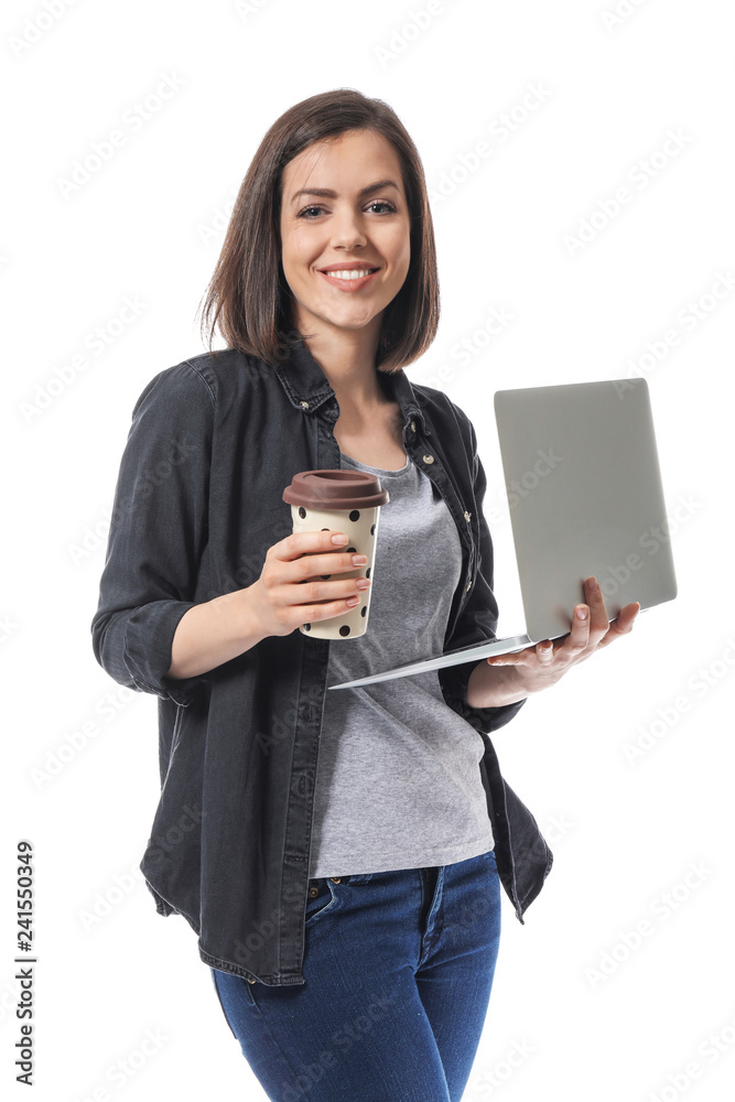 Young woman with laptop and cup of coffee on white background