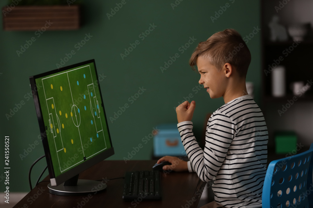 Cute little boy after losing computer game at home Cute little boy after losing computer game at home