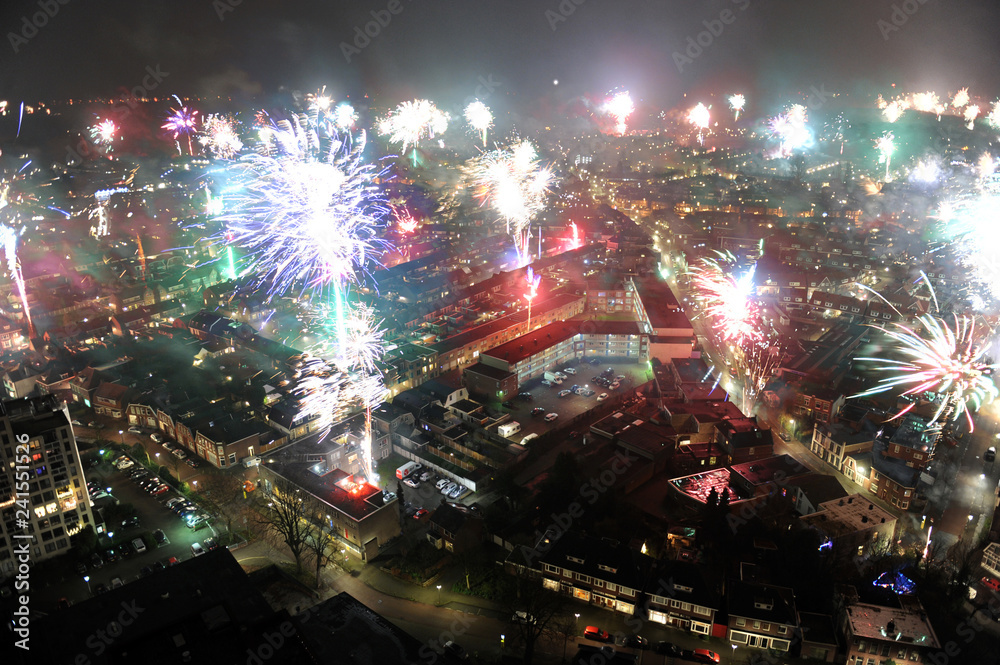 Fireworks on new years eve as seen from a 101 meters high building in the center of Enschede in the Netherlands