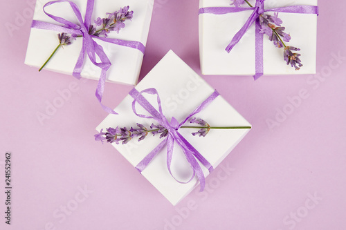 White Gift box with violet ribbon and lavender