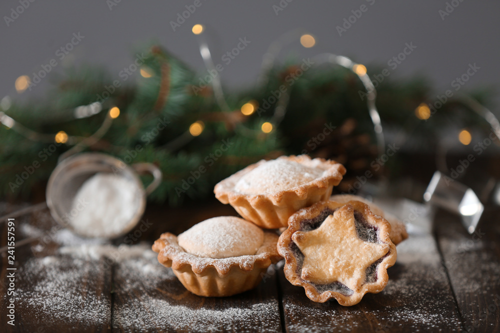 Tasty mince pies on wooden table Tasty mince pies on wooden table