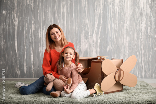 Portrait of happy mother wi...